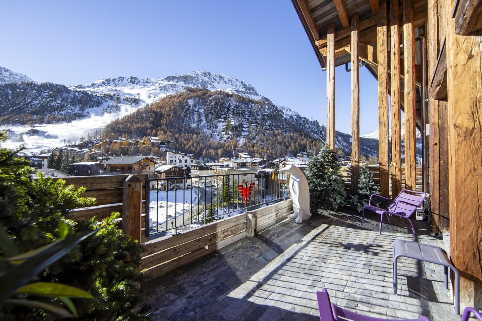 Private balcony with mountain views and lounge seating for three