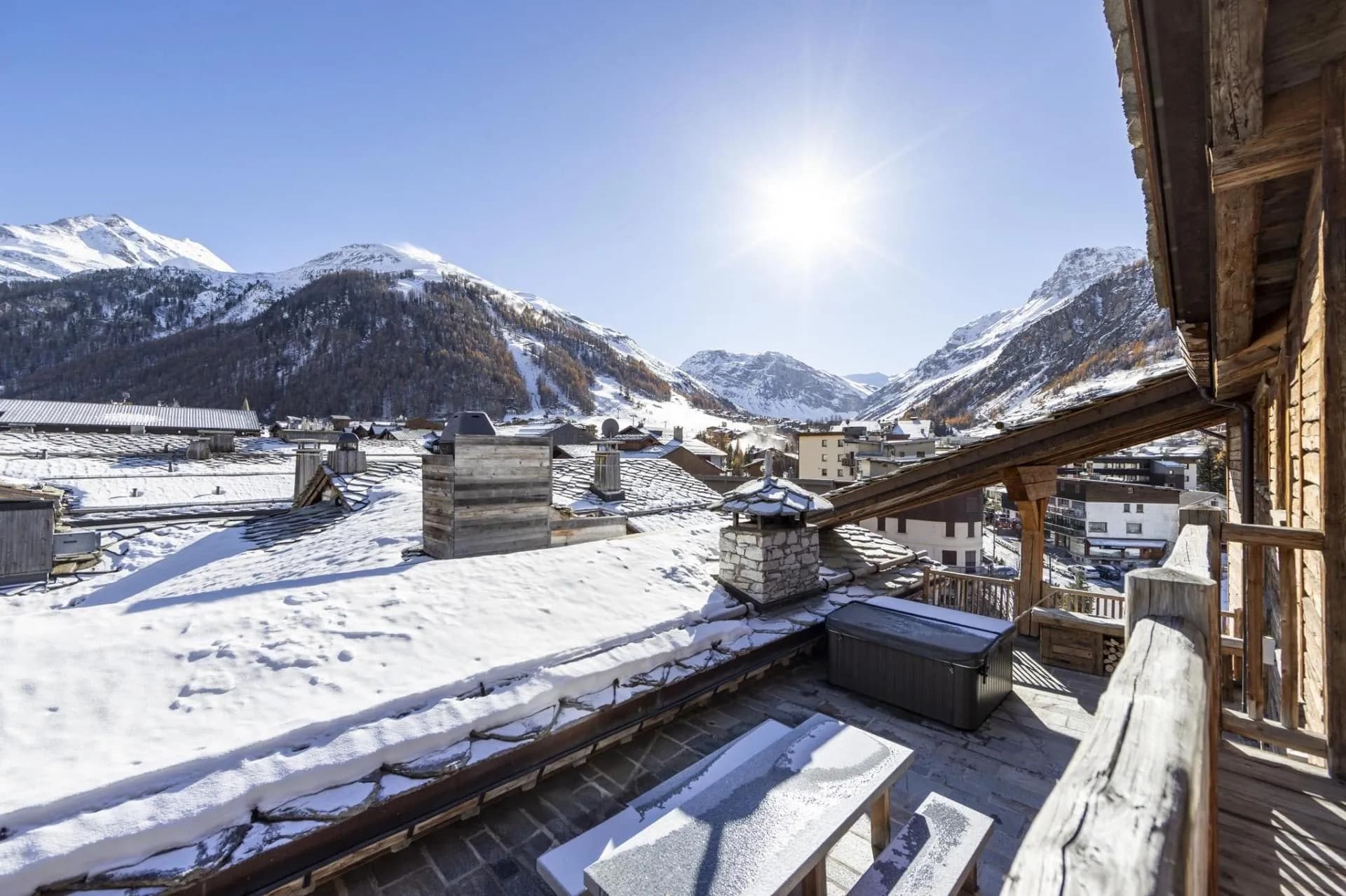 Heated terrace with outdoor Jacuzzi and alpine valley views