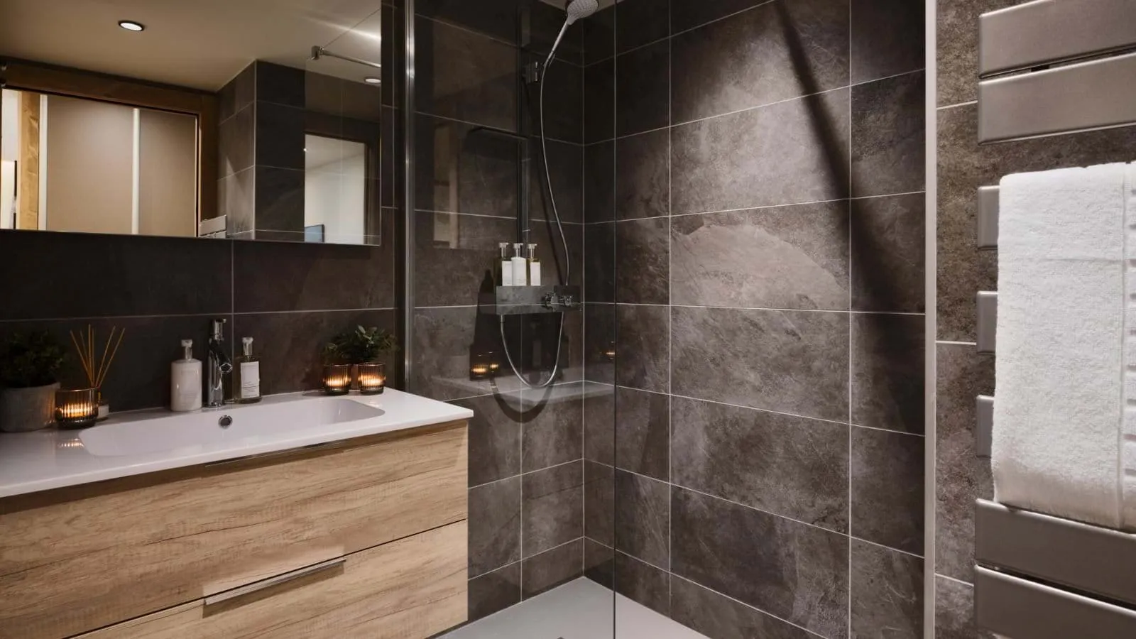En-suite shower room with rainfall shower and heated towel rail
