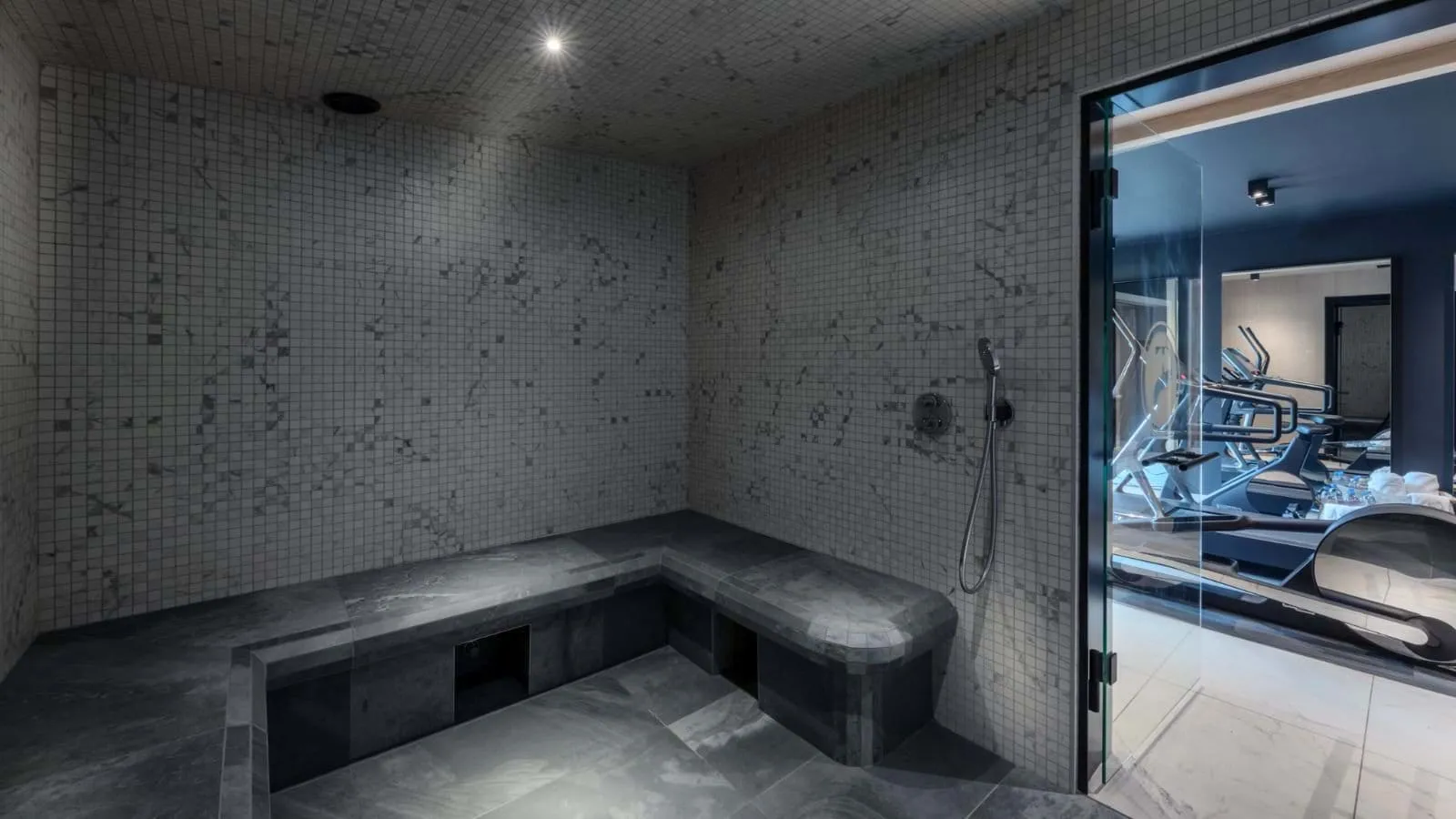 Shared hammam with tiled bench seating