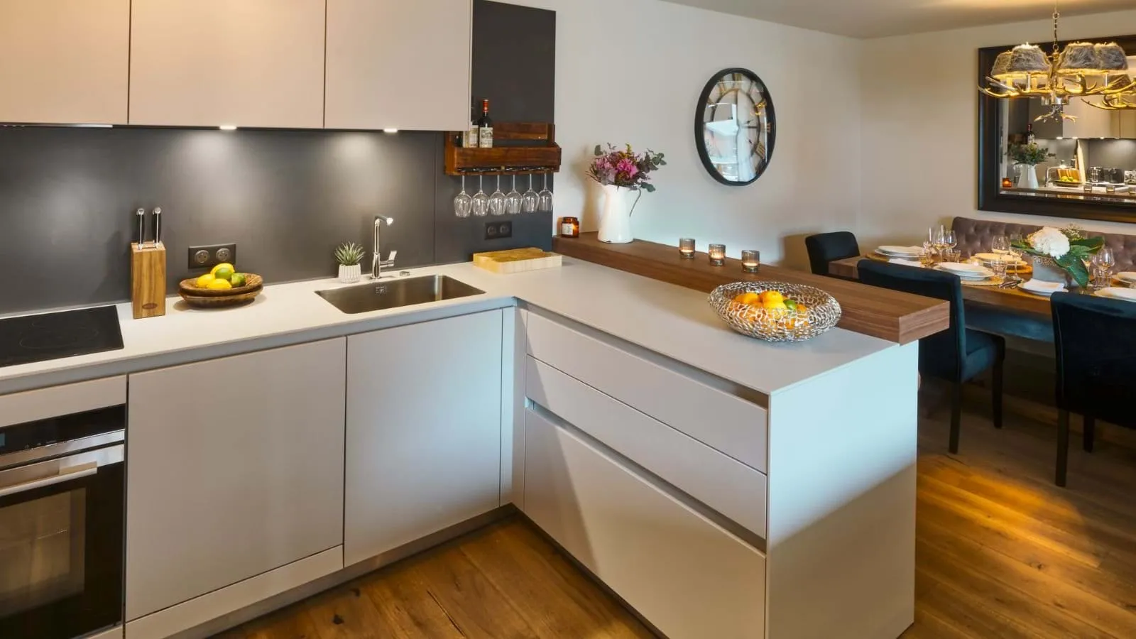Modern kitchen with induction hob and breakfast-bar seating