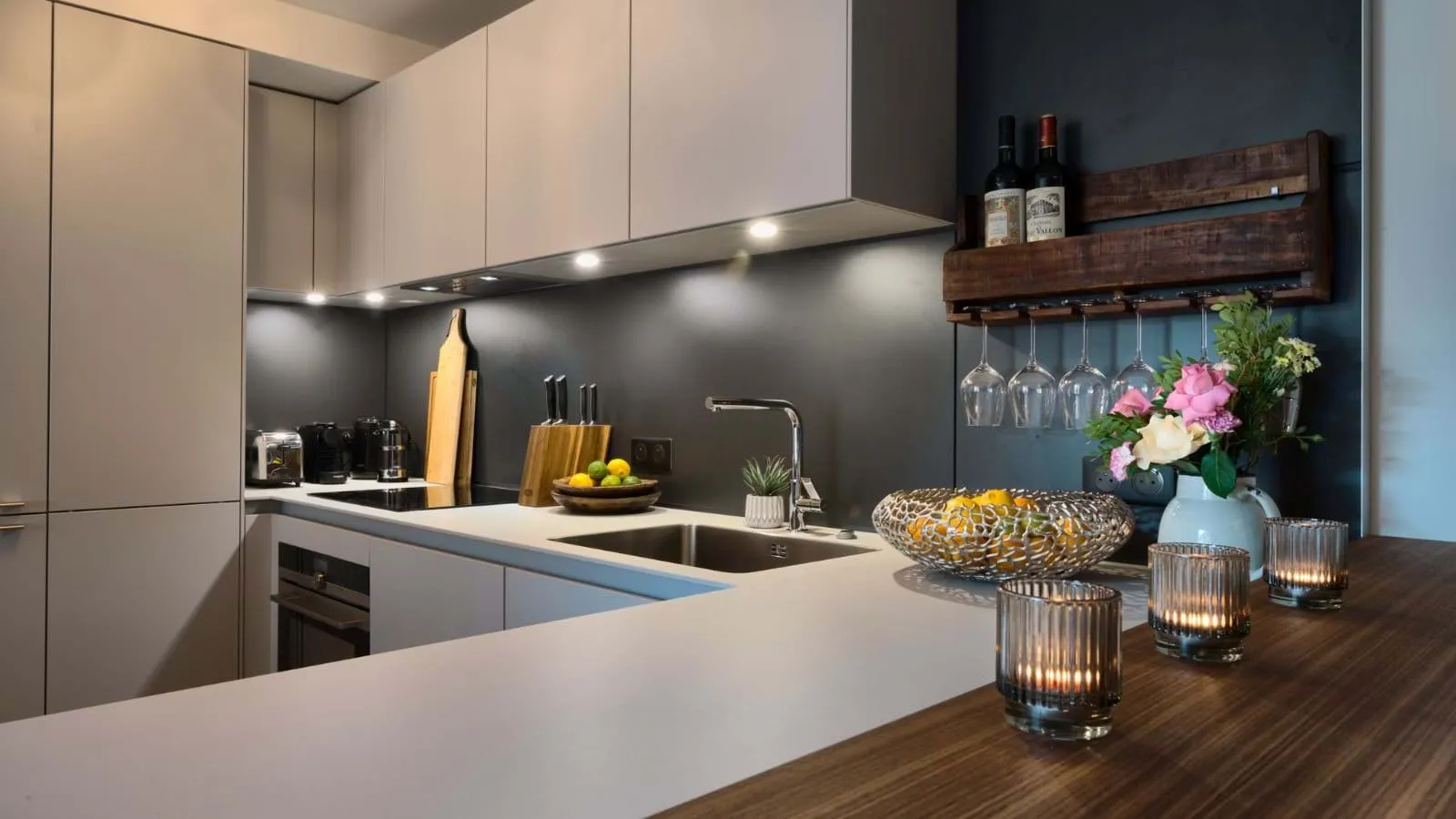 Modern kitchen with wine rack and integrated appliances