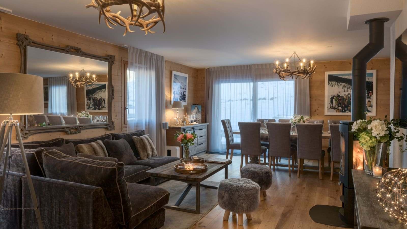 Open-plan living area with wood-burning stove and dining for 10