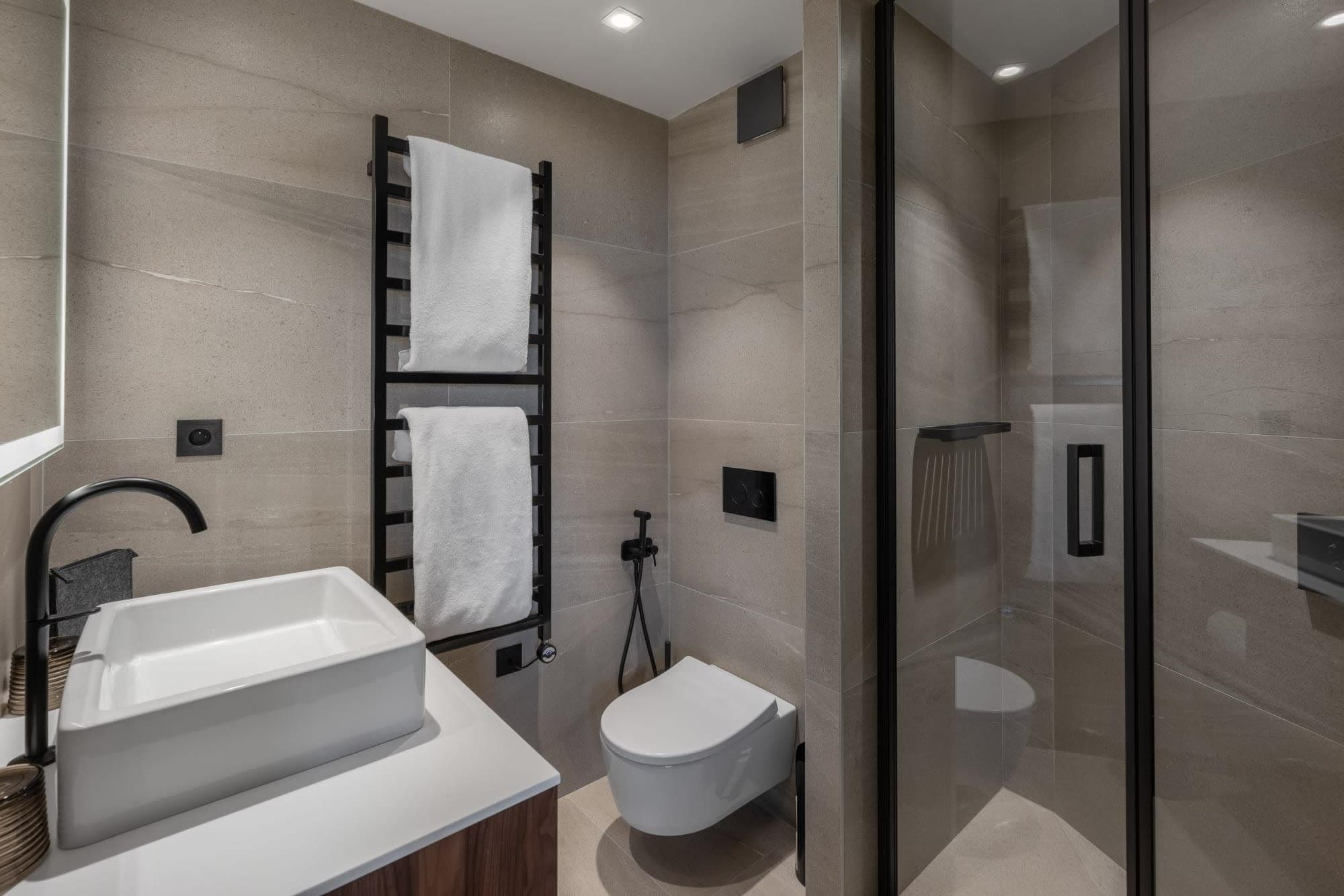 Bathroom with walk-in shower and heated towel rack