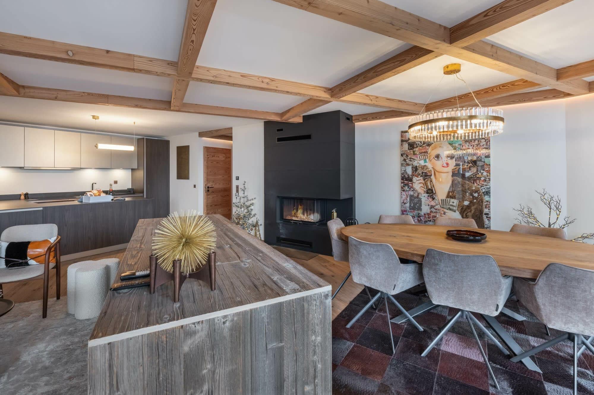 Open-plan dining area with wood-burning fireplace and seating for 8