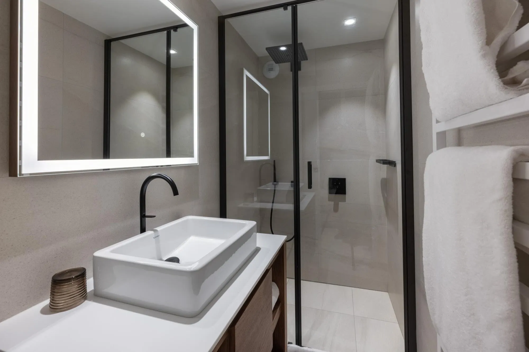 En-suite shower room with rainfall shower and heated towel rail