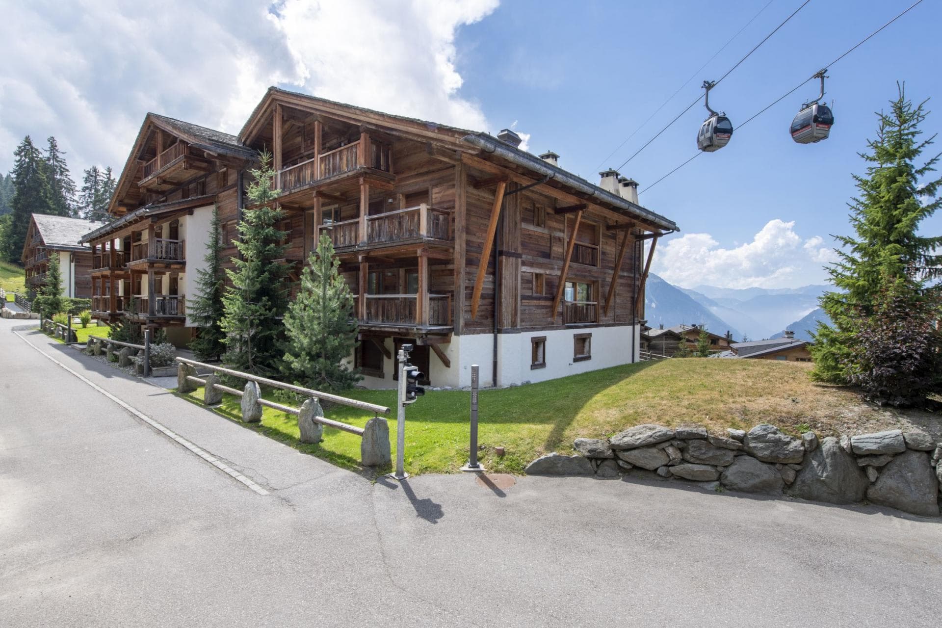 Chalet exterior with mountain views and direct gondola lift proximity