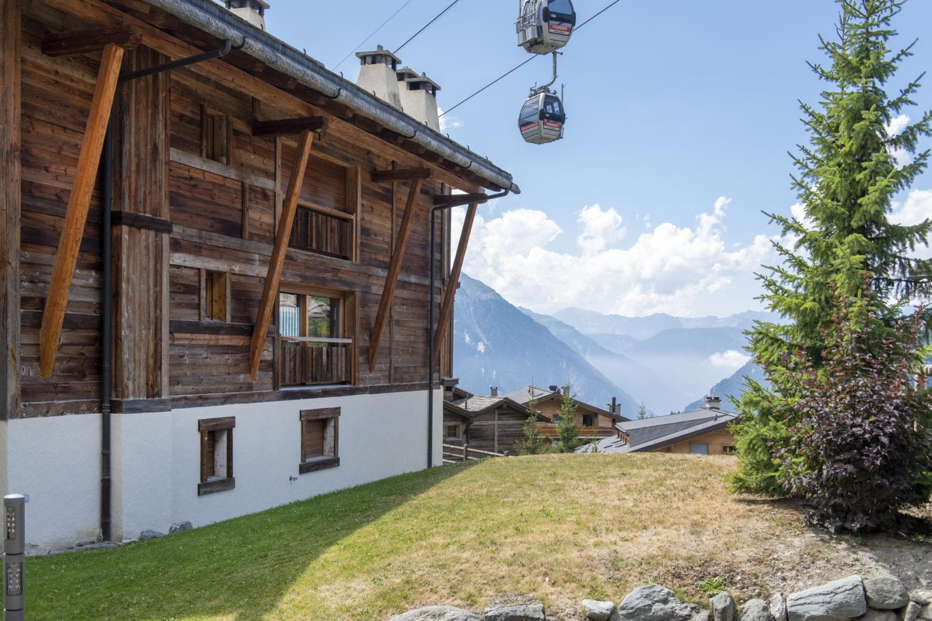 Chalet exterior with mountain valley views and direct gondola access