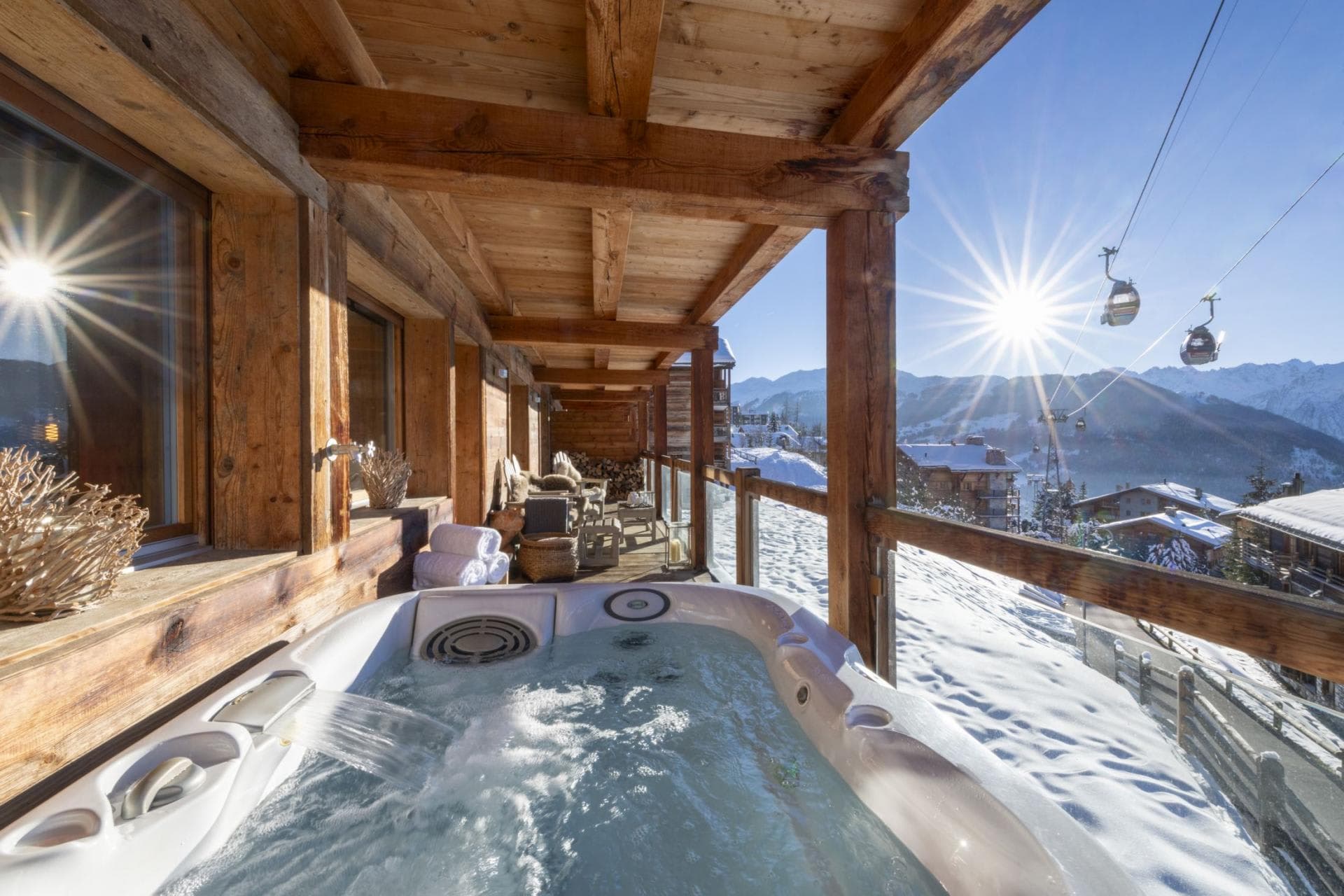 Covered balcony hot tub with mountain views and gondola access nearby