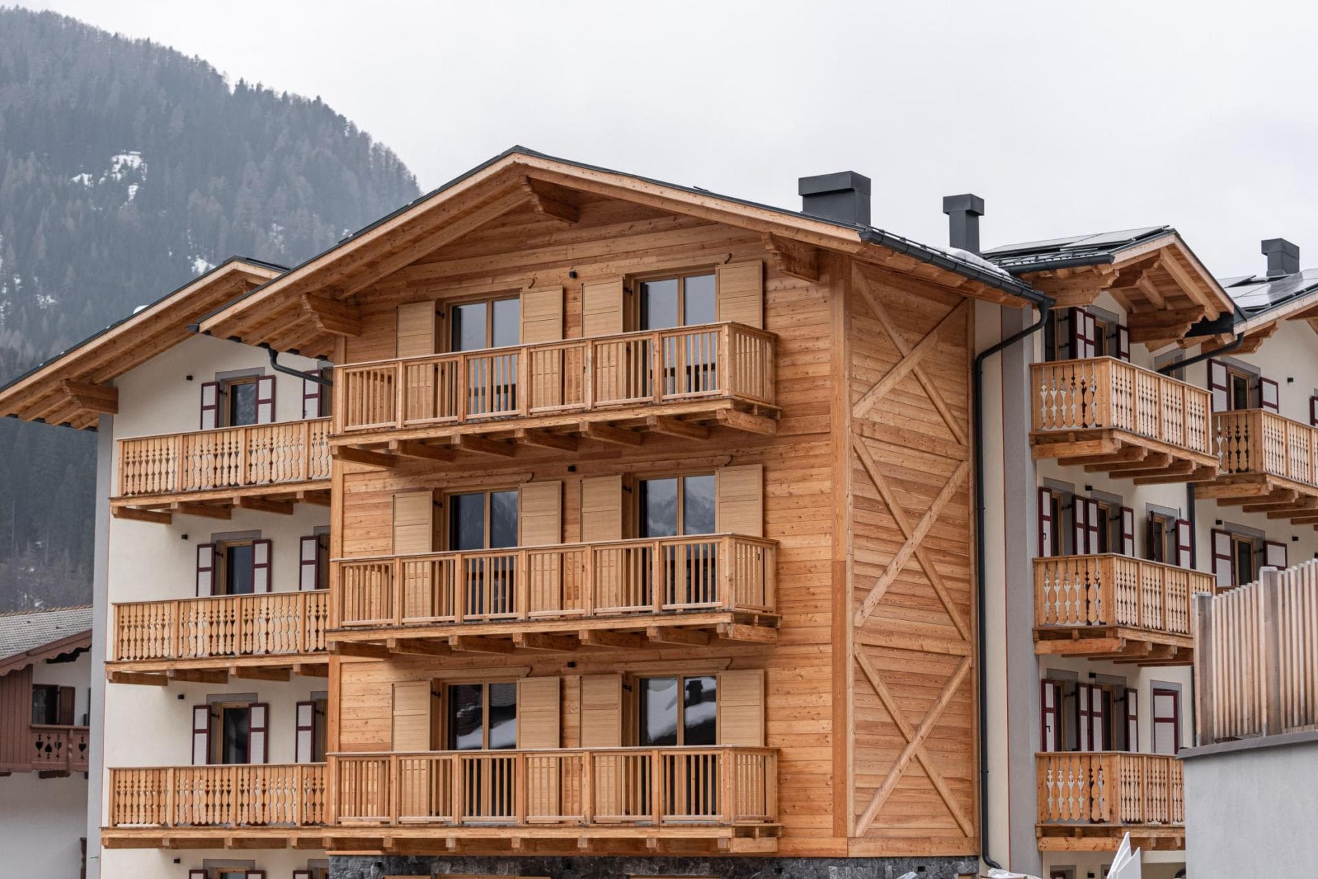 Chalet exterior featuring private timber balconies and mountain views