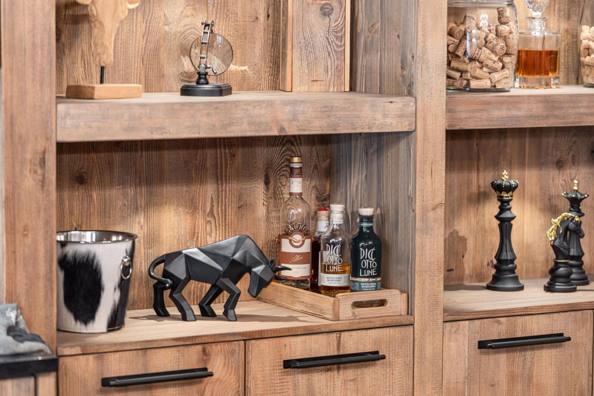 Built-in wet bar with reclaimed wood shelving and integrated spirit storage