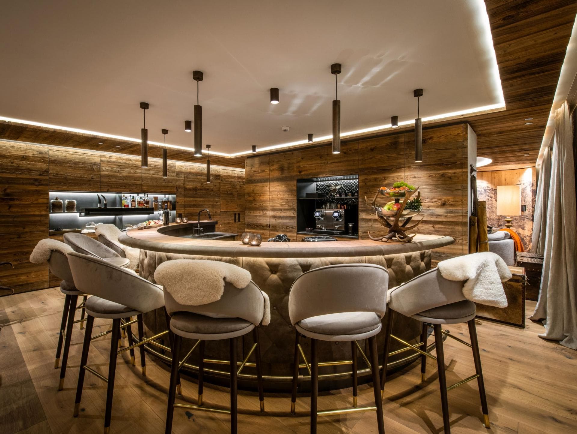 Curved bar with seating for five and professional espresso machine