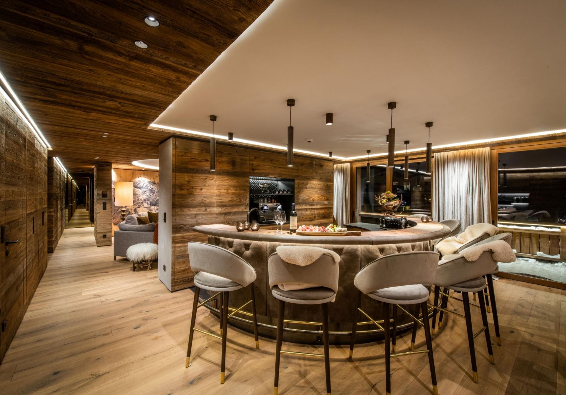 Circular wet bar with seating for 5 and built-in espresso station