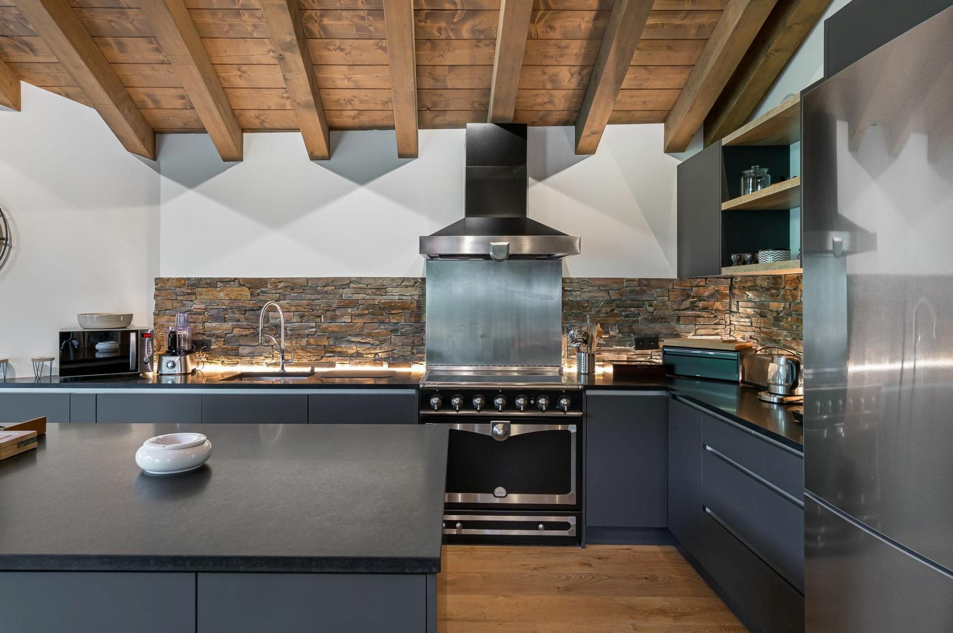 Fitted kitchen with range cooker, island and integrated appliances