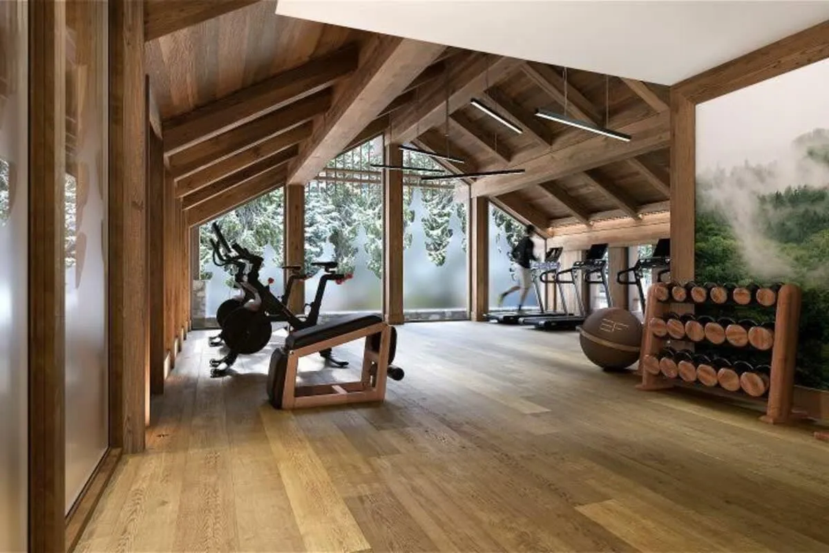 Shared fitness room with exercise machines and free weights