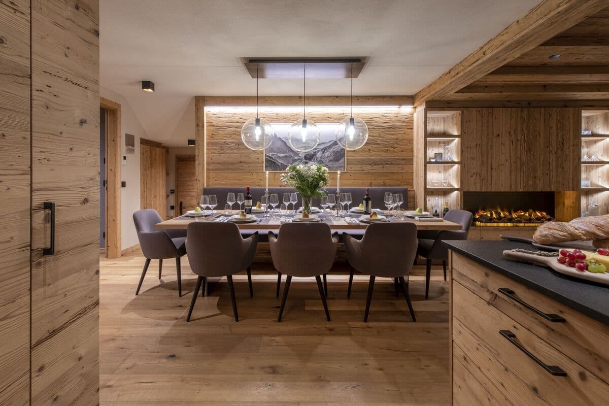 Dining table seats 10 with bench seating and electric fireplace