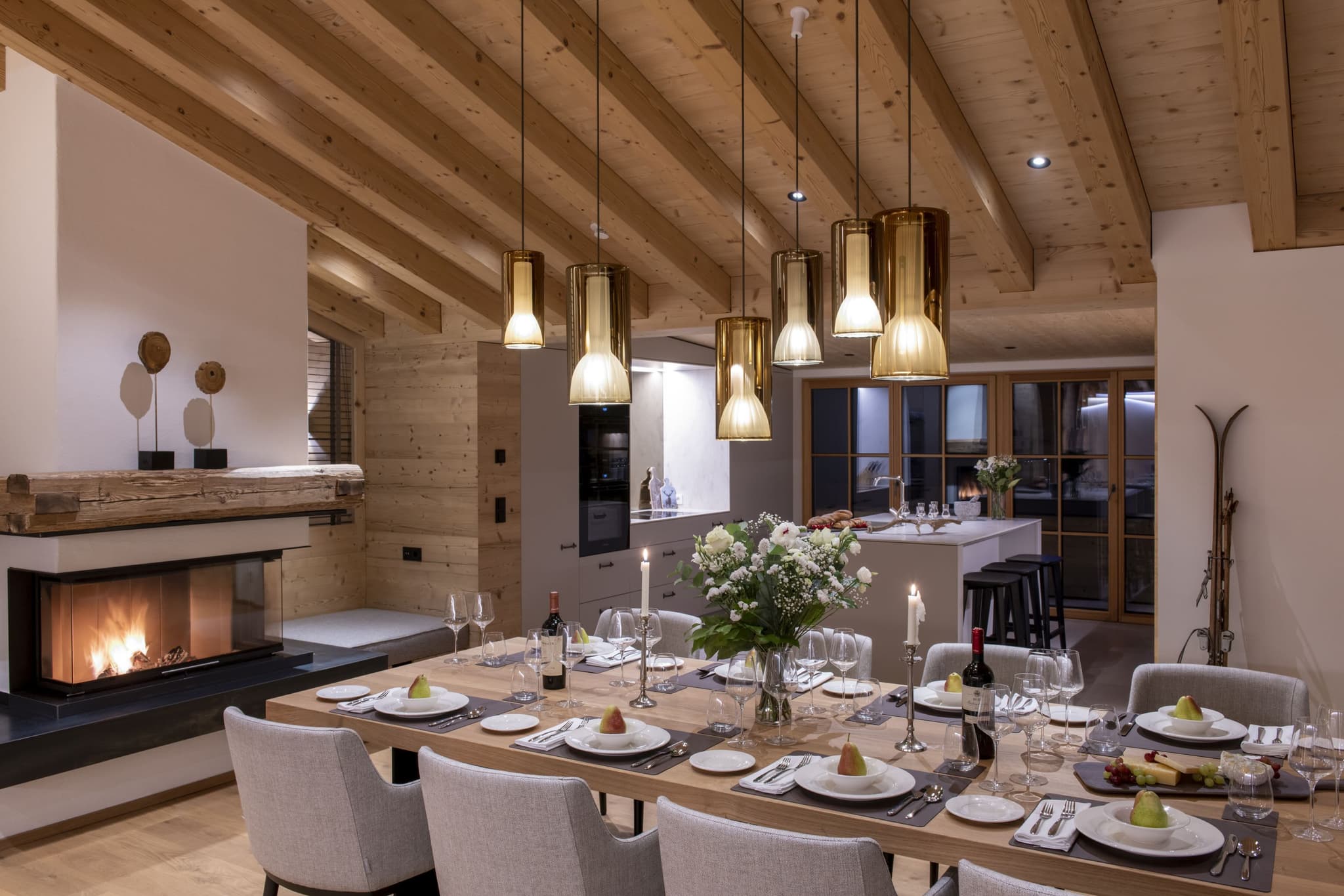 Dining area for 10 with wood-burning fireplace and kitchen island seating