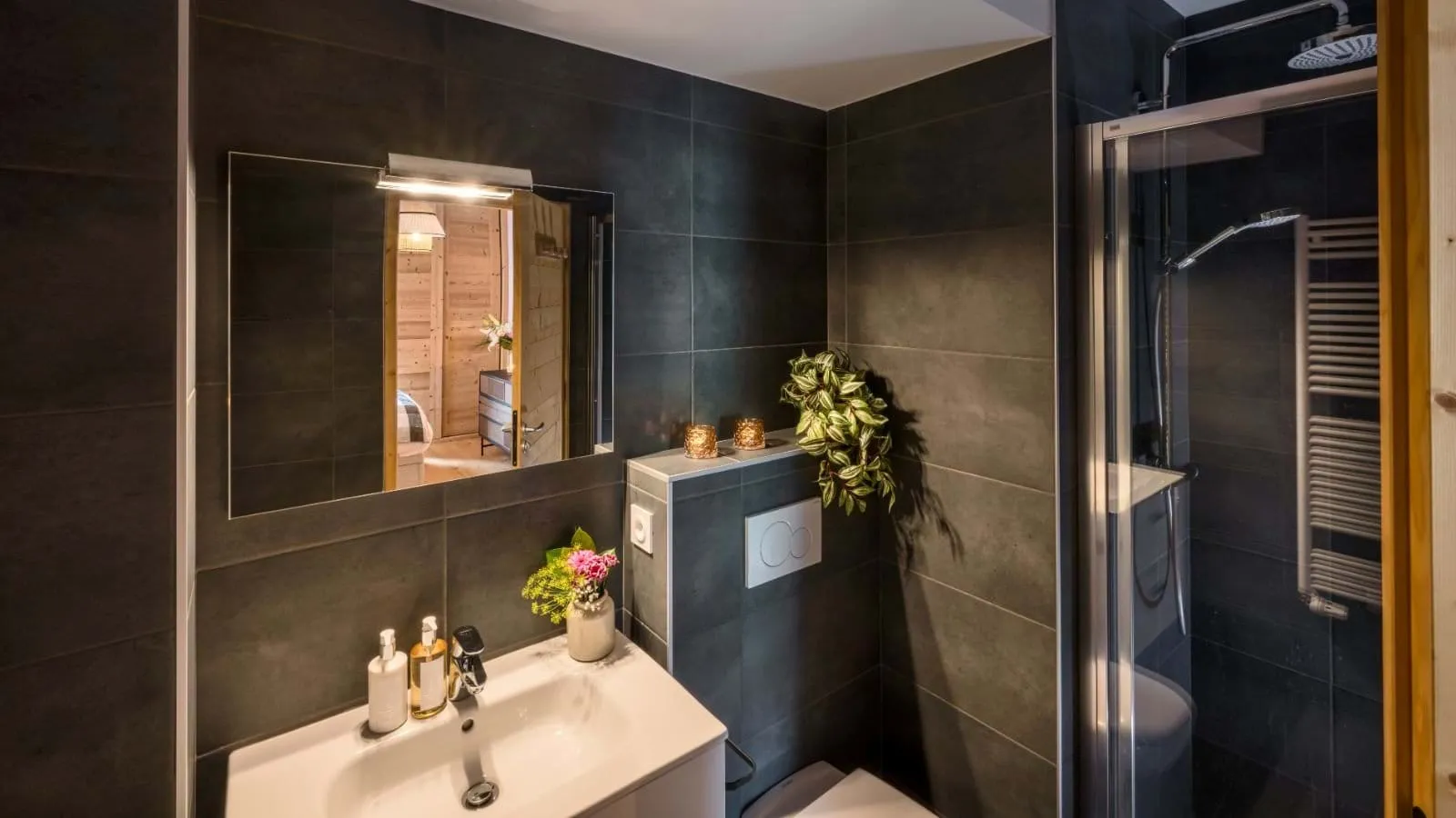 Shower room with a basin, mirror and heated towel rail