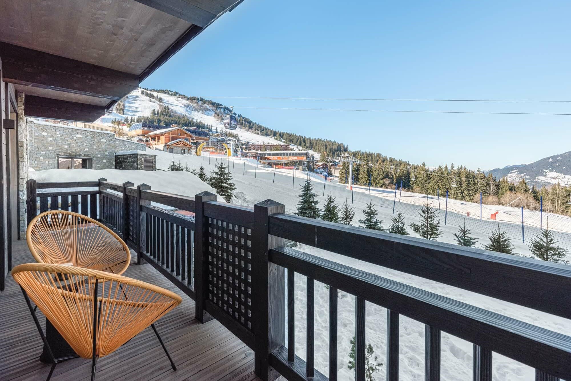 Private balcony with Acapulco seating and ski-in/ski-out slope views