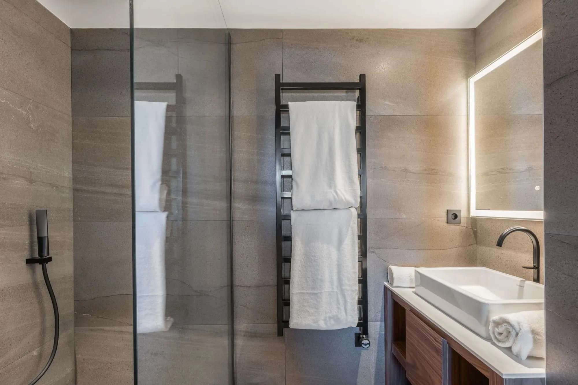 Bathroom with walk-in shower and heated towel rail
