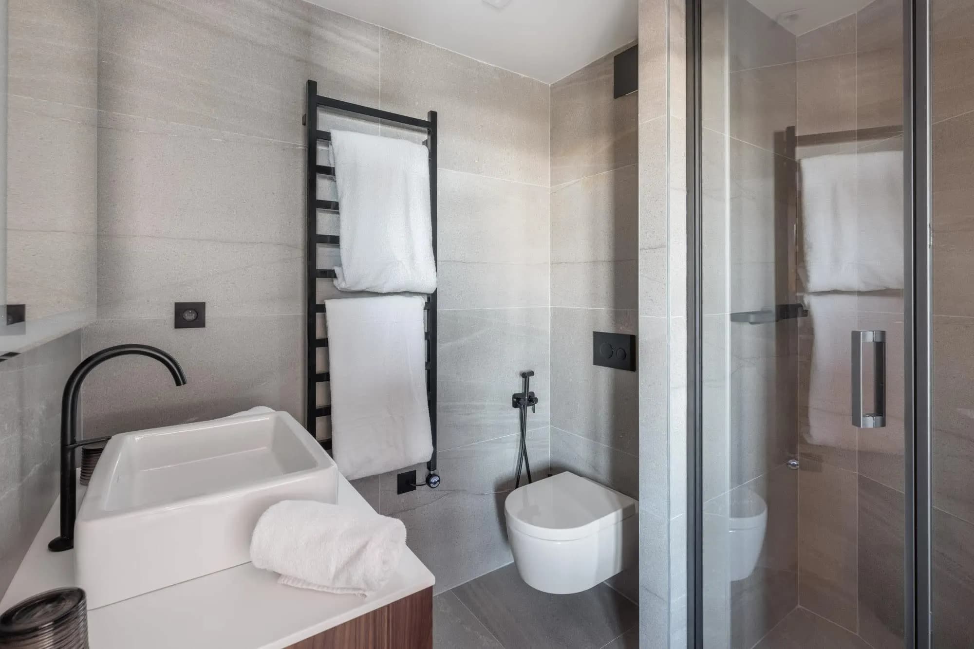 Bathroom with walk-in shower and heated towel rail