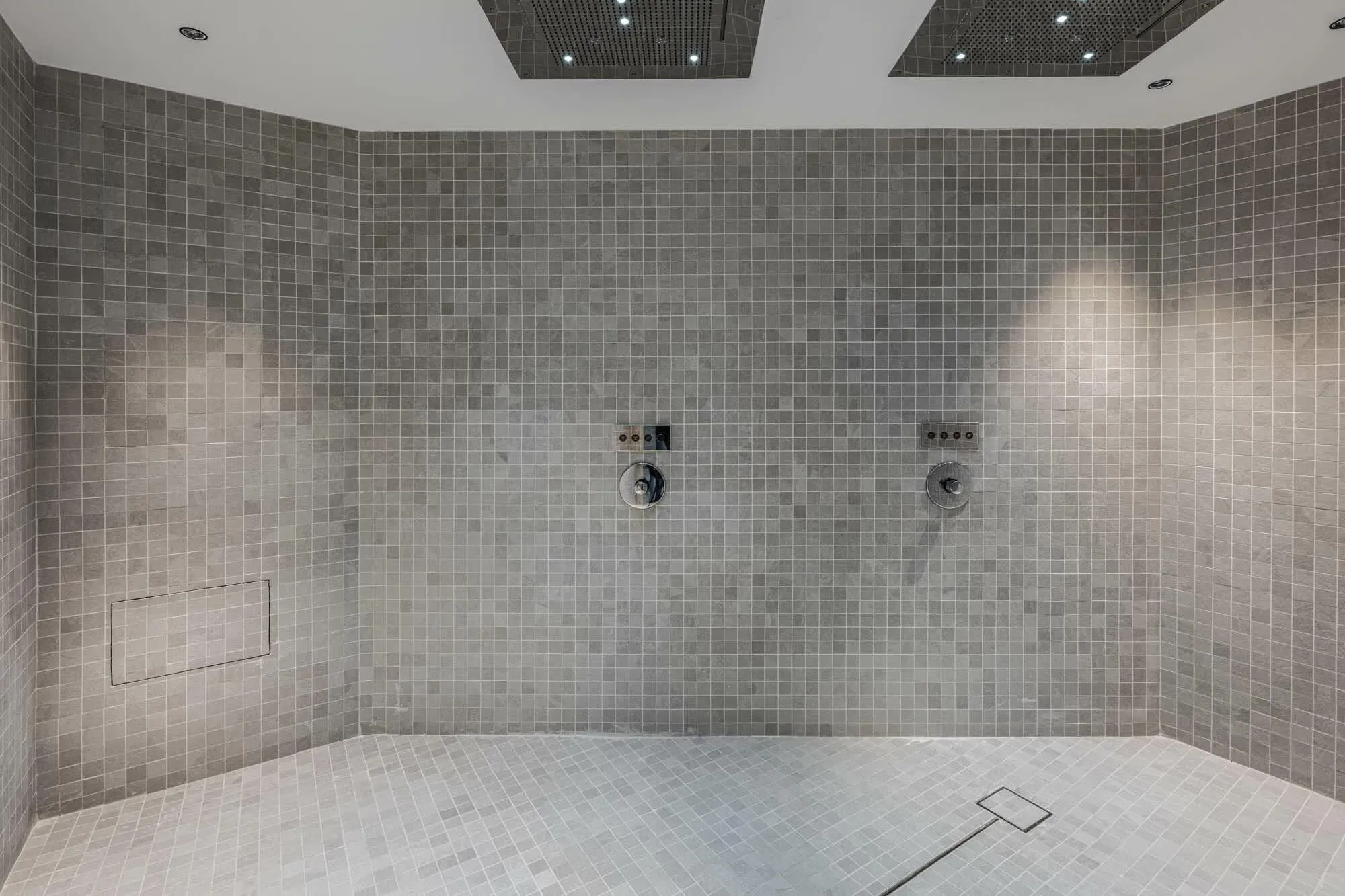 Walk-in shower room with mosaic tiling