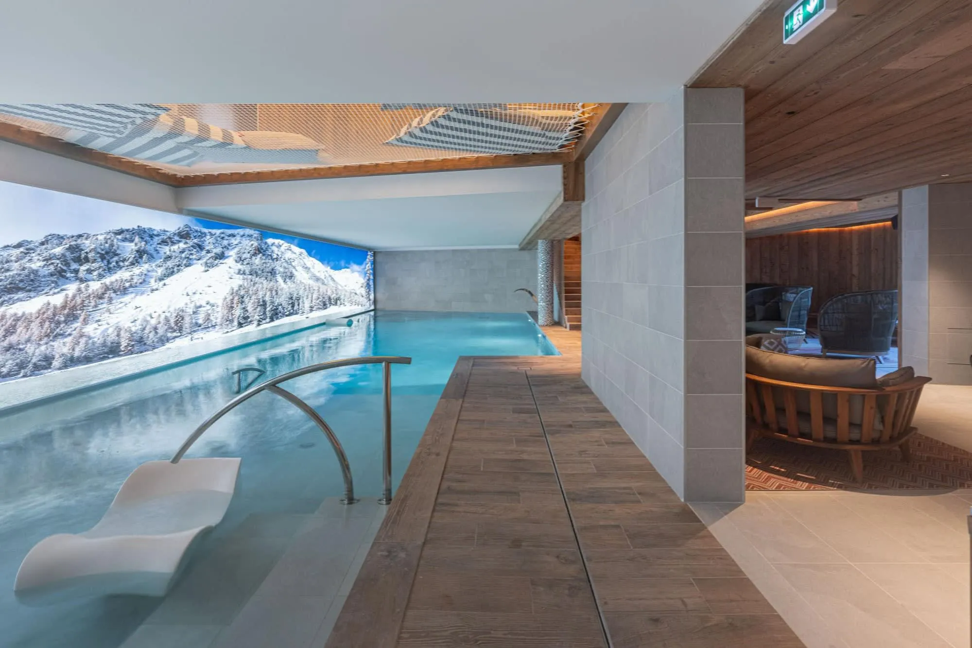 Indoor infinity pool with overhead relaxation nets
