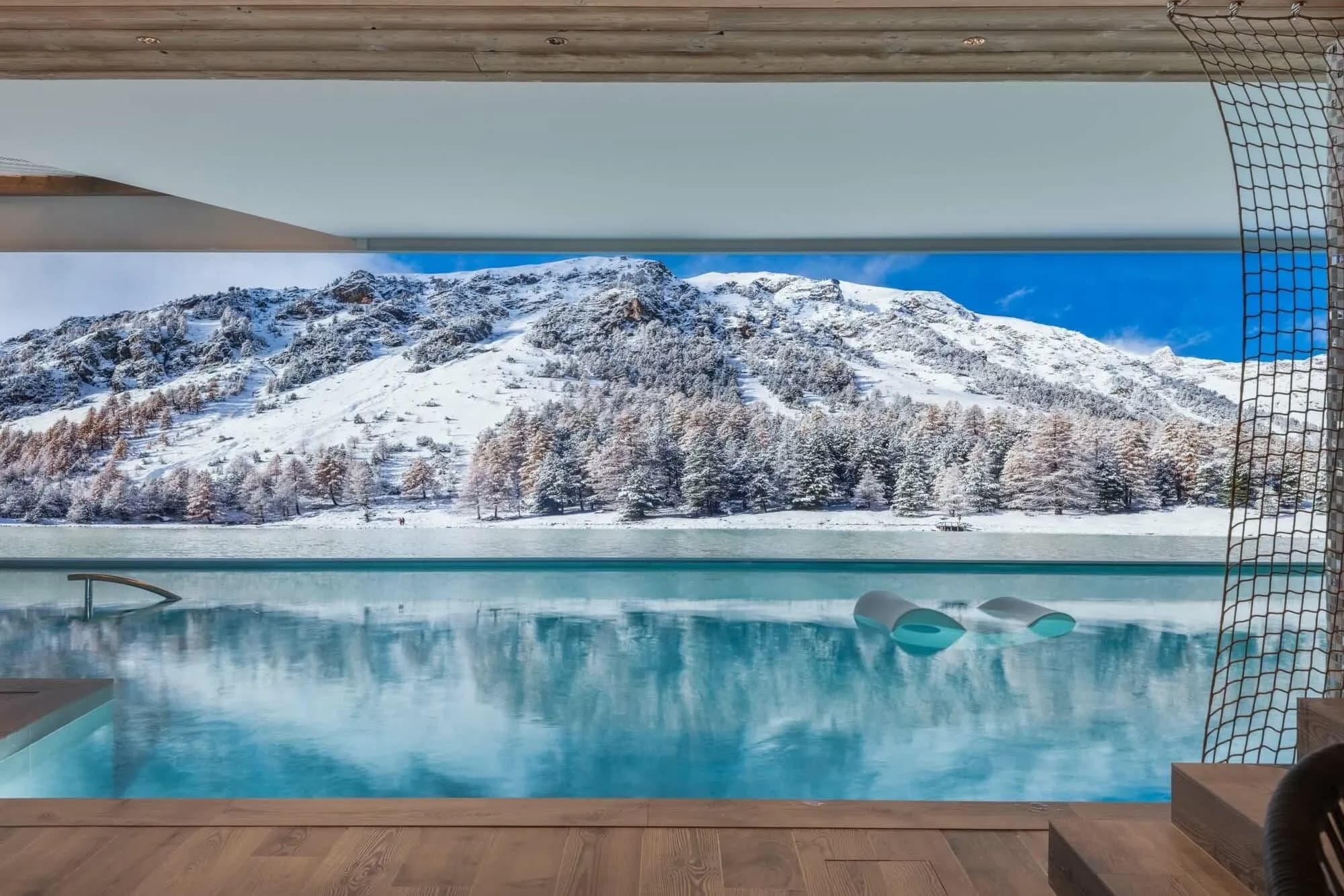 Indoor infinity pool overlooking the surrounding mountains
