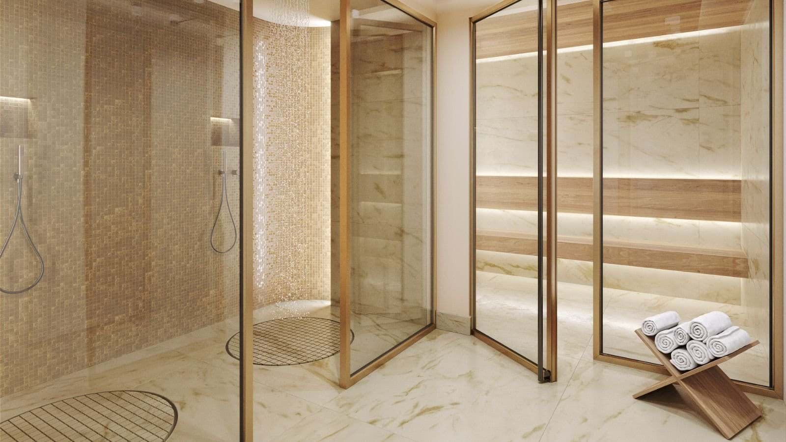 Dual walk-in rainfall showers and glass-enclosed wood sauna