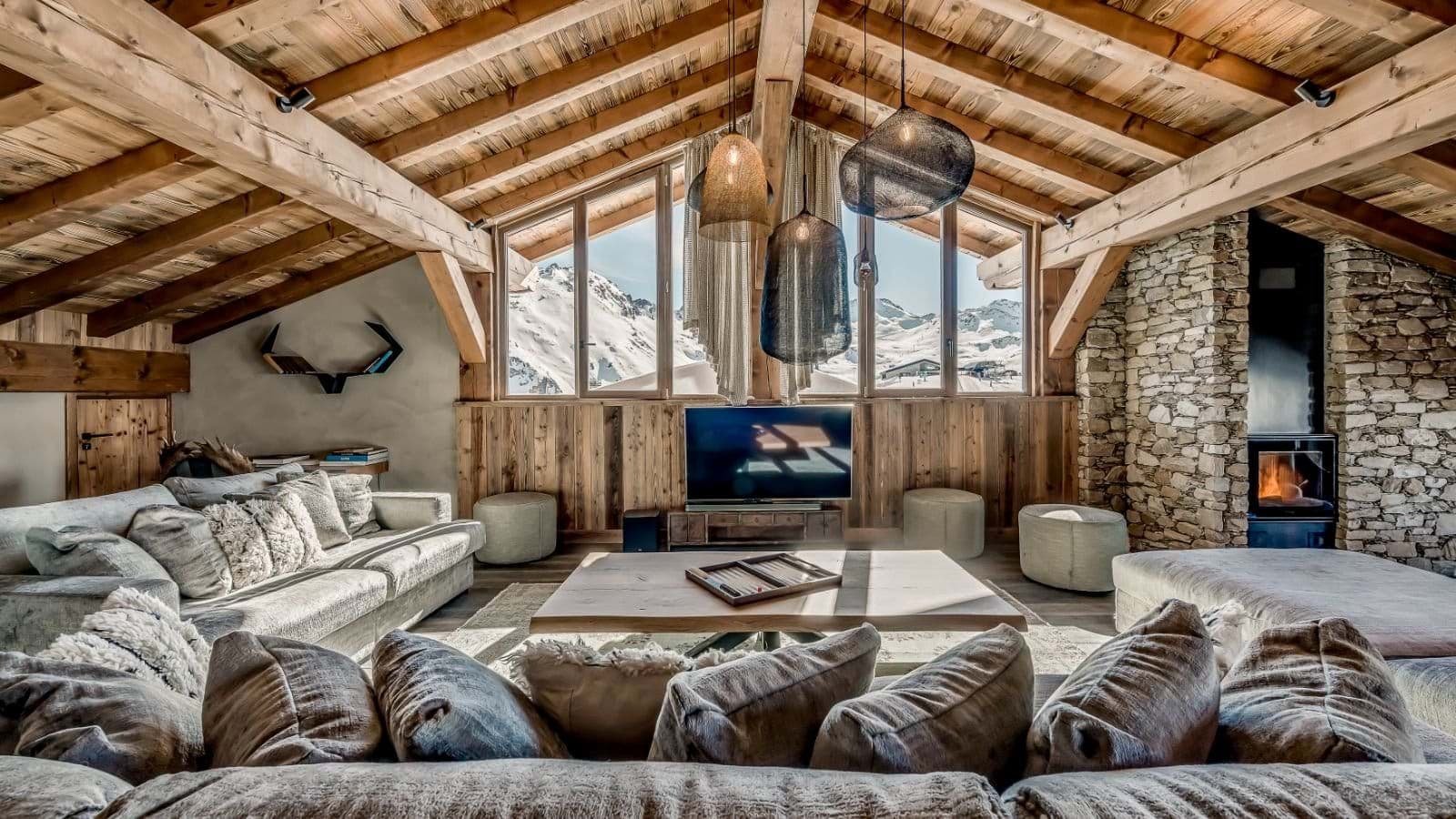 Living area with wood-burning fireplace and panoramic mountain views