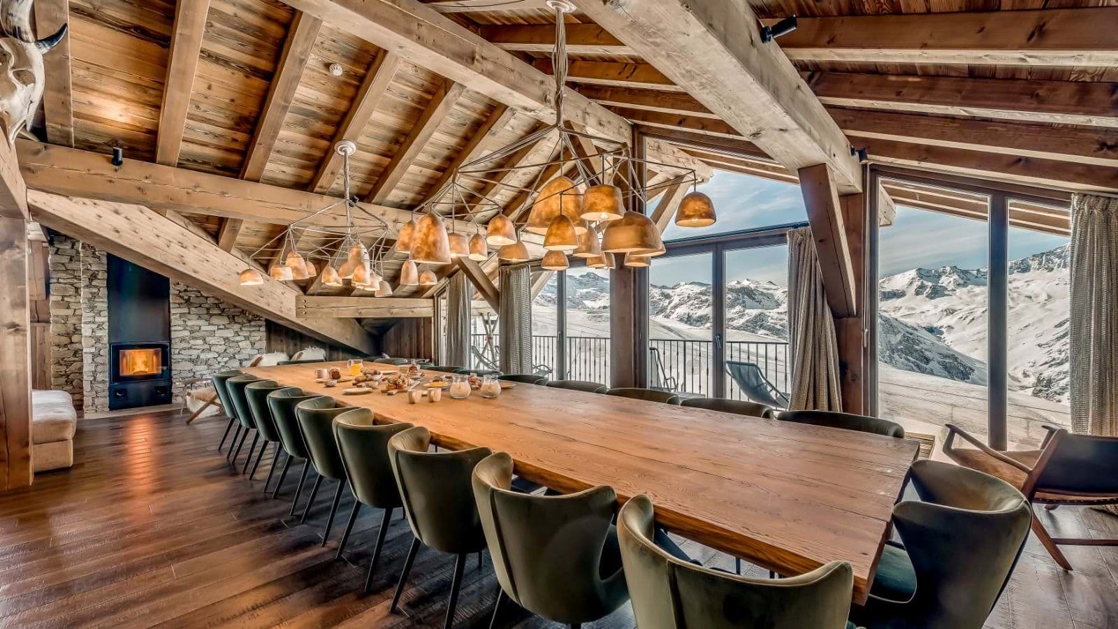 Dining area seating 14 with mountain views and wood-burning fireplace