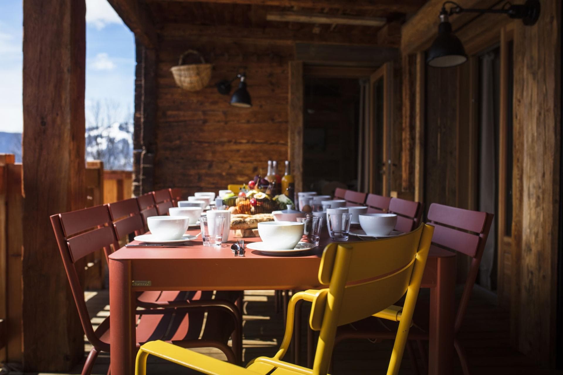 Covered terrace with outdoor dining for 10 and mountain views