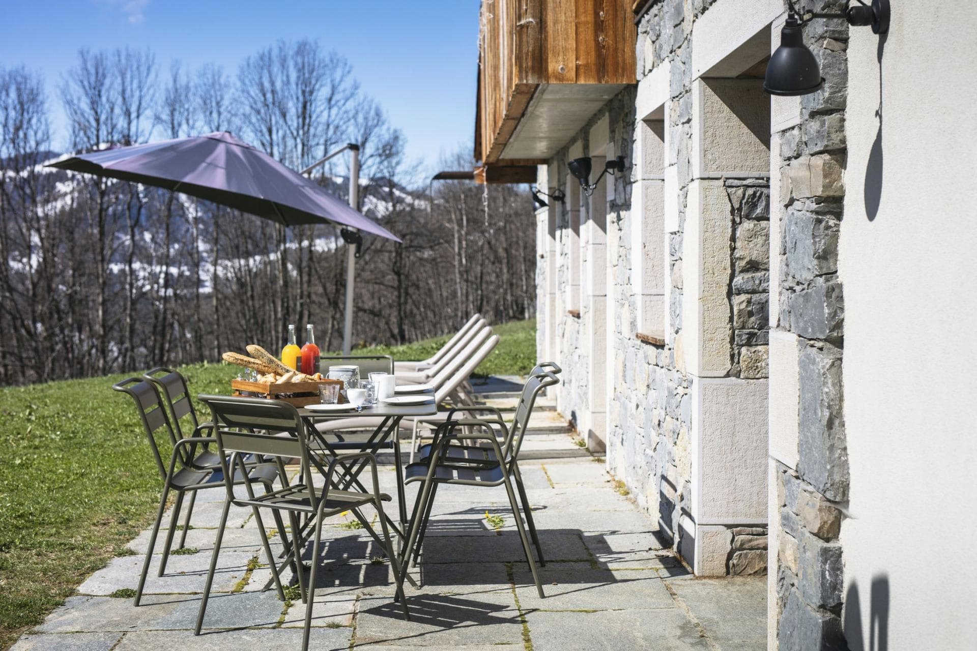Stone patio with dining for 6 and mountain views