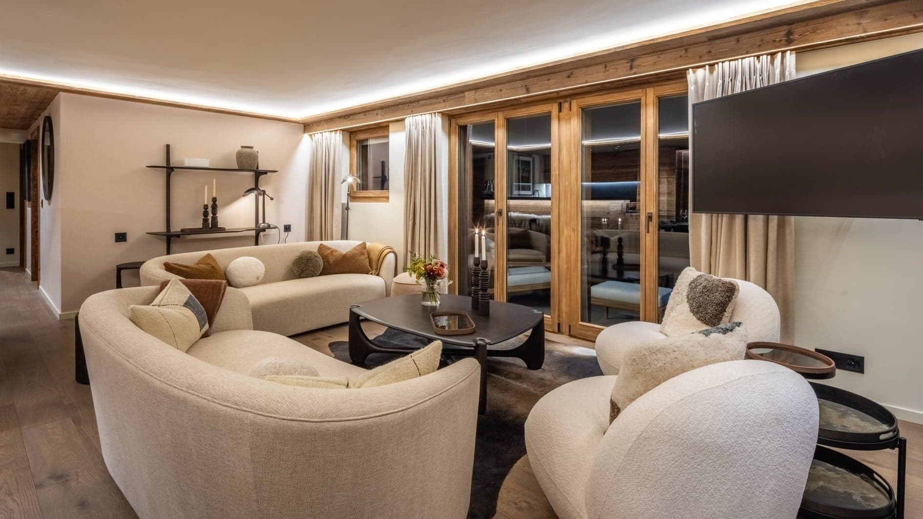 Living room with seating for 8, curved sofas, and wall-mounted TV