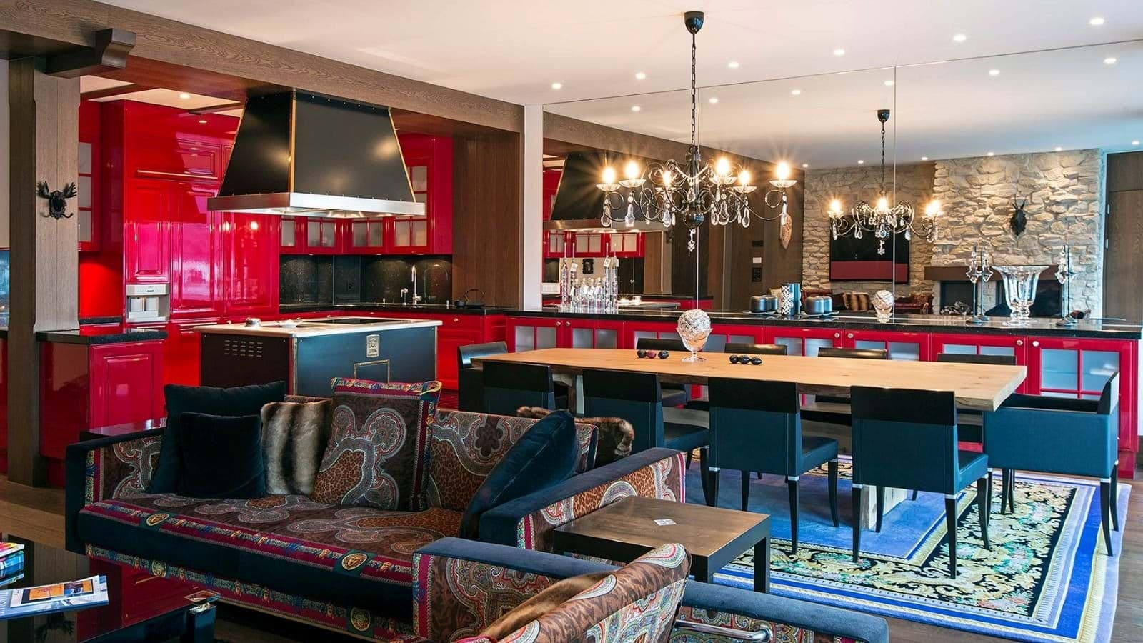 Open-plan living area with 8-person dining table and chef's kitchen