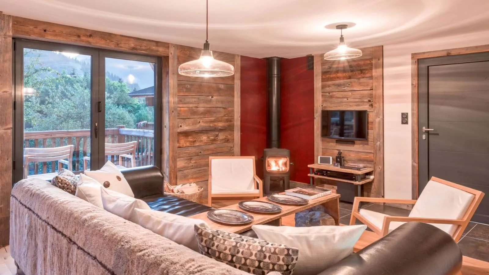 Living area with a wood-burning stove and balcony access