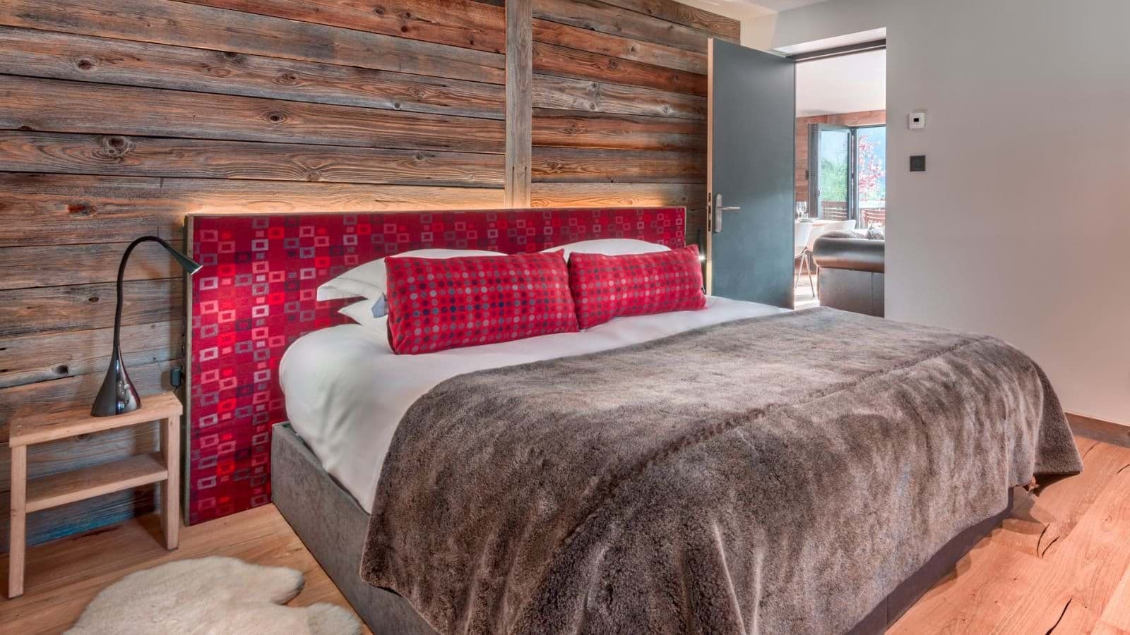 Bedroom with king bed and reclaimed wood accent wall