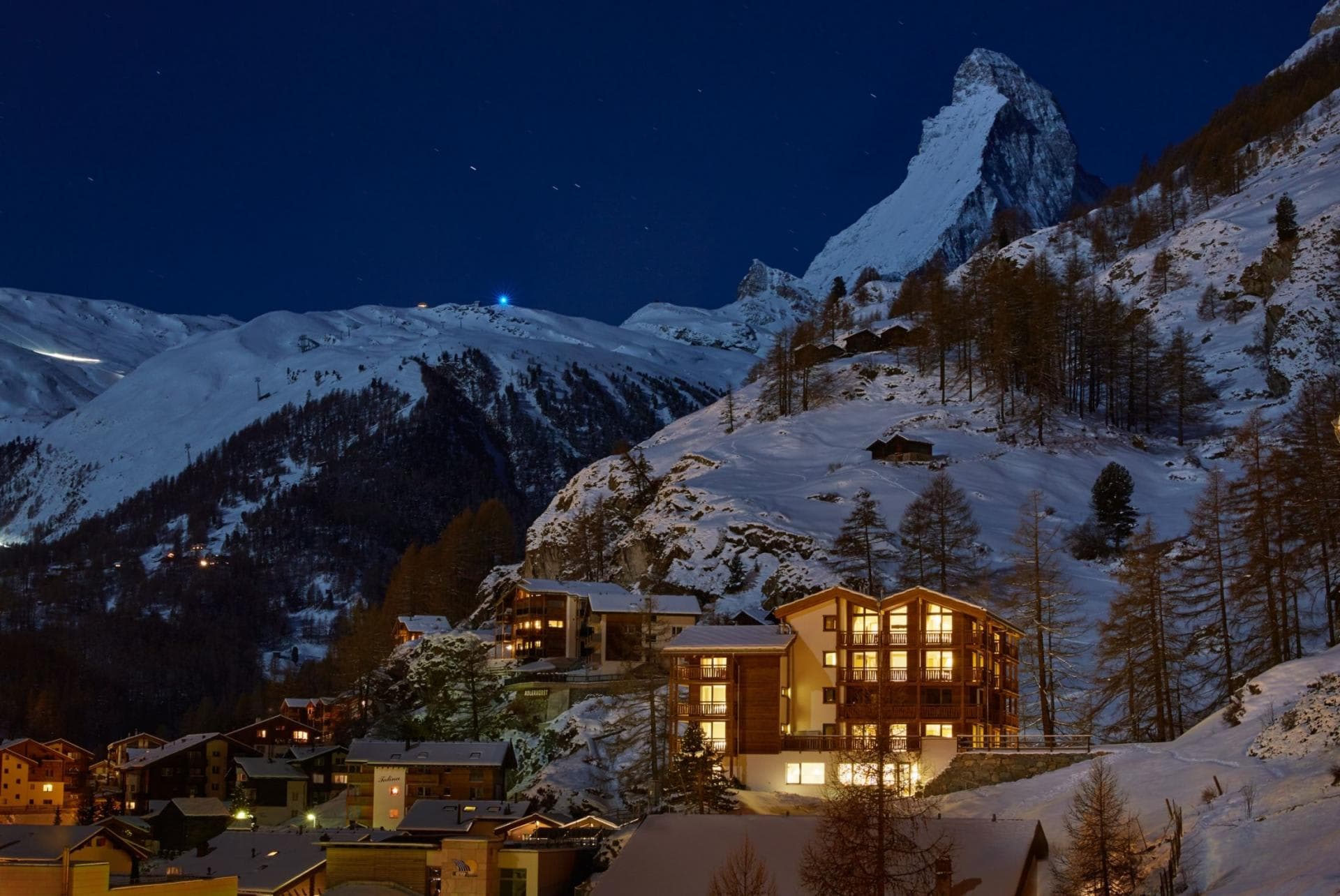 Chalet exterior at night with direct views of the Matterhorn