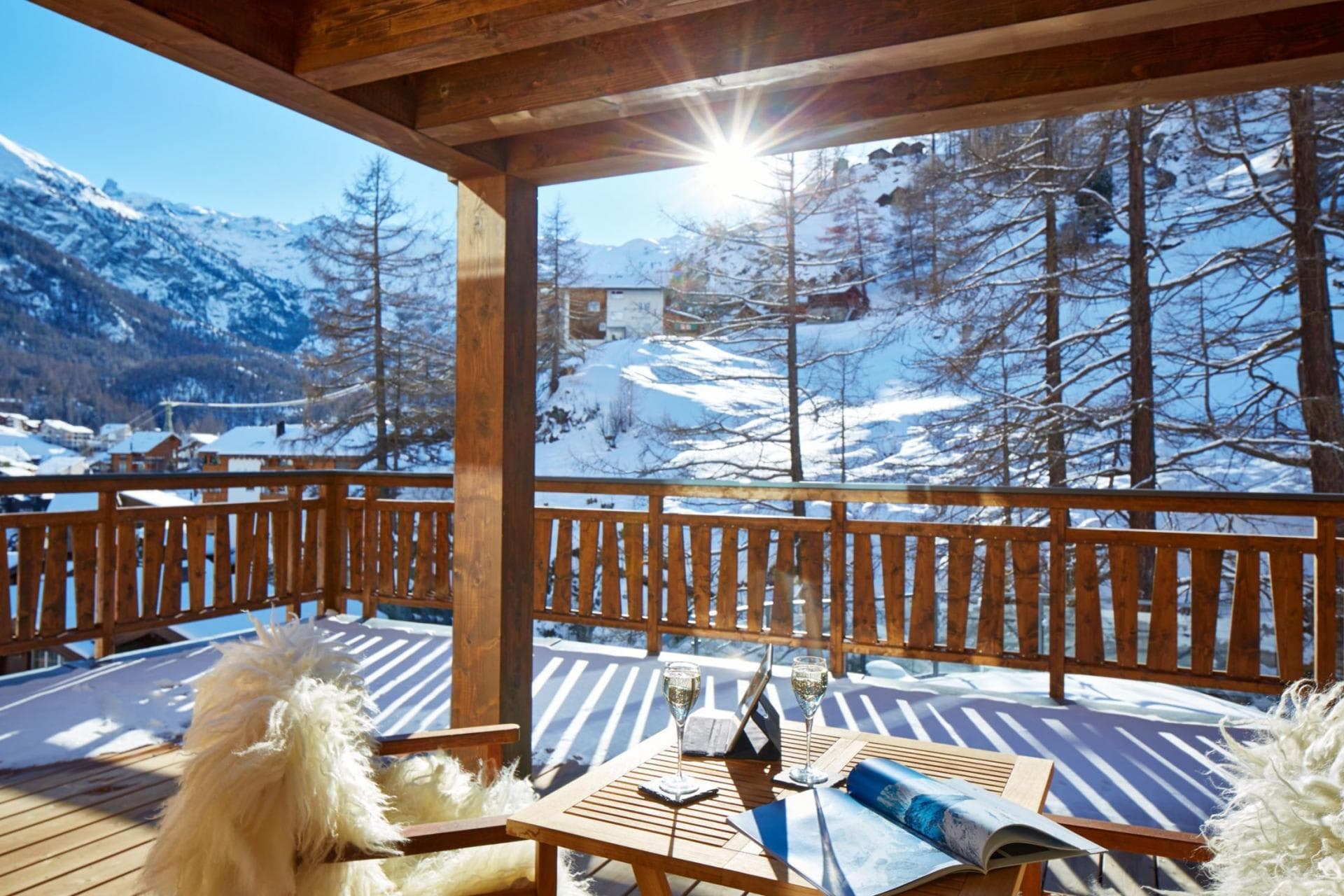 Covered timber balcony with south-facing mountain views and lounge seating