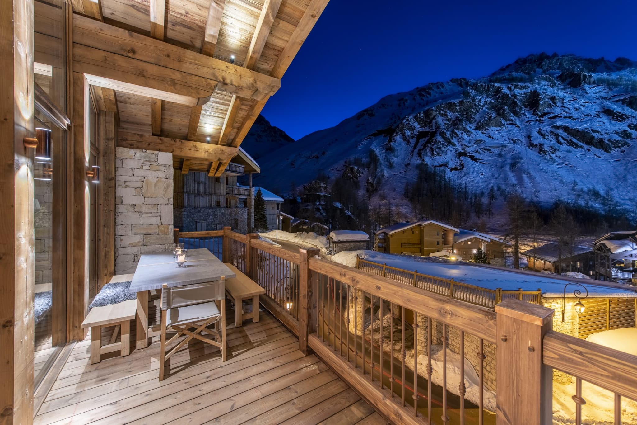 Covered balcony with bench seating and views of Val-d'Isère slopes