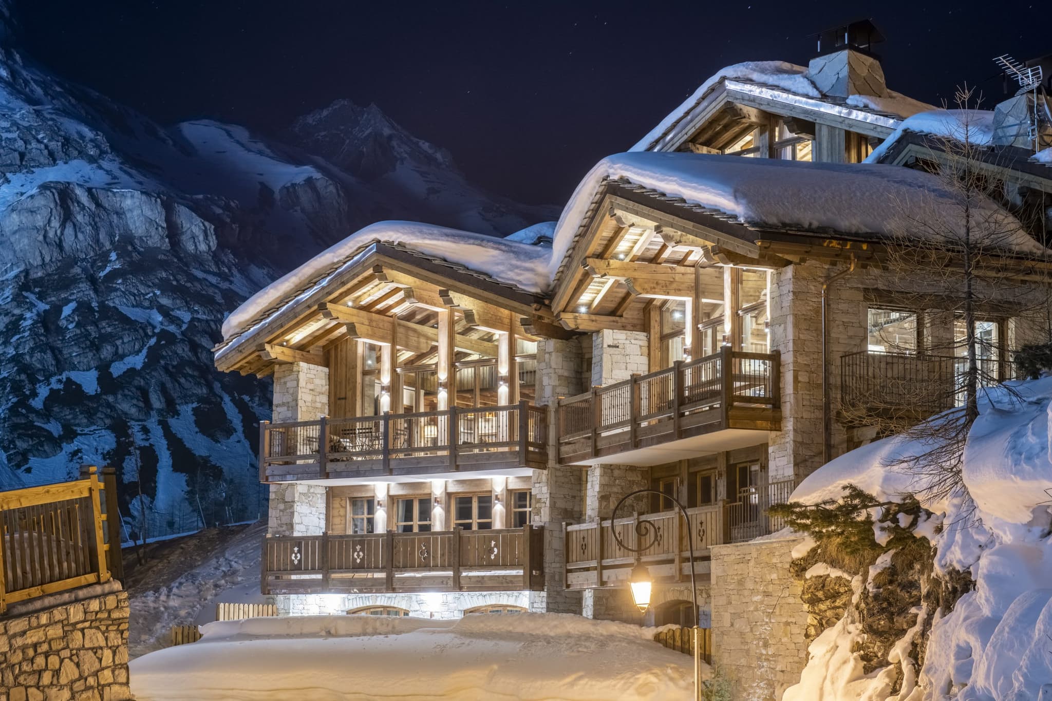 Ski-in chalets with heated stone balconies and mountain views