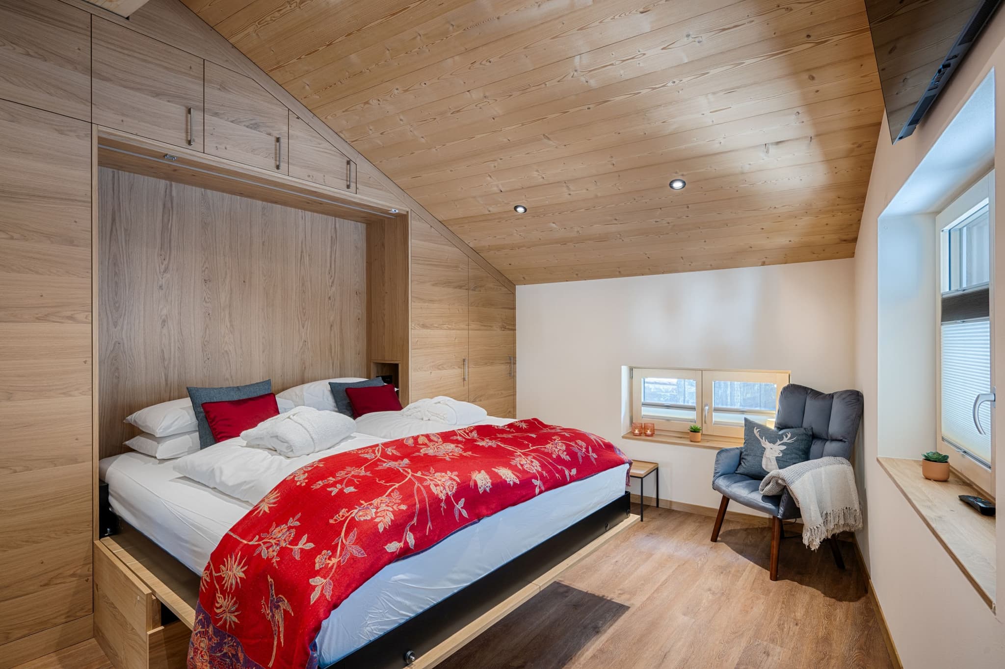 Attic bedroom with king bed and custom built-in storage