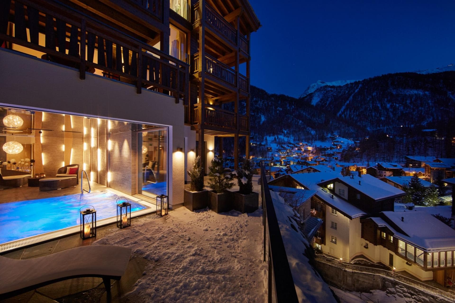 Heated indoor-outdoor pool with panoramic village and mountain views