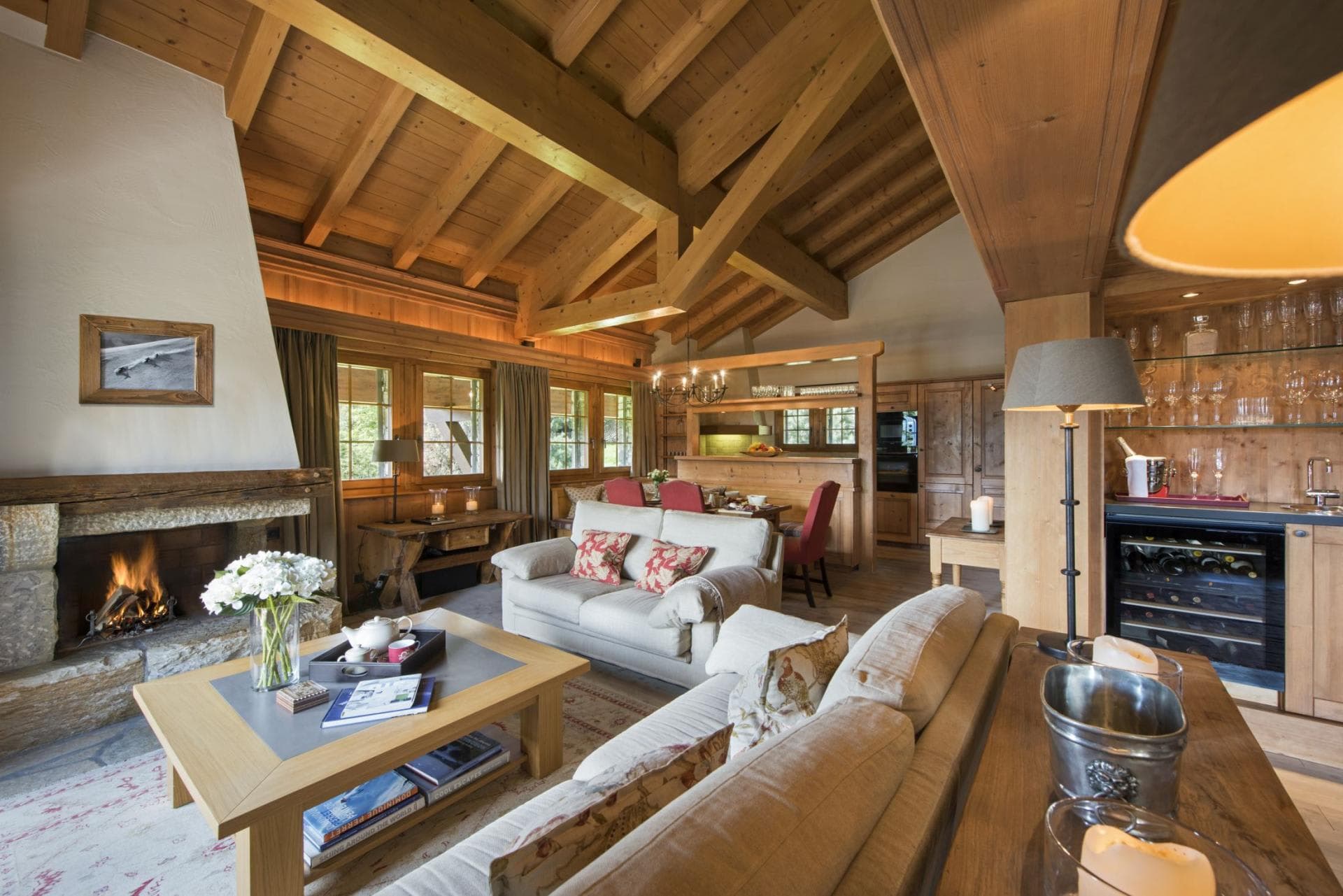 Open-plan living area with wood-burning fireplace and integrated wine cooler