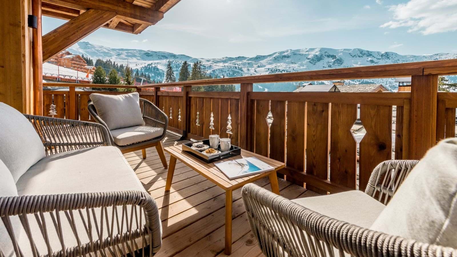 Private balcony with lounge seating for four and ski slope views