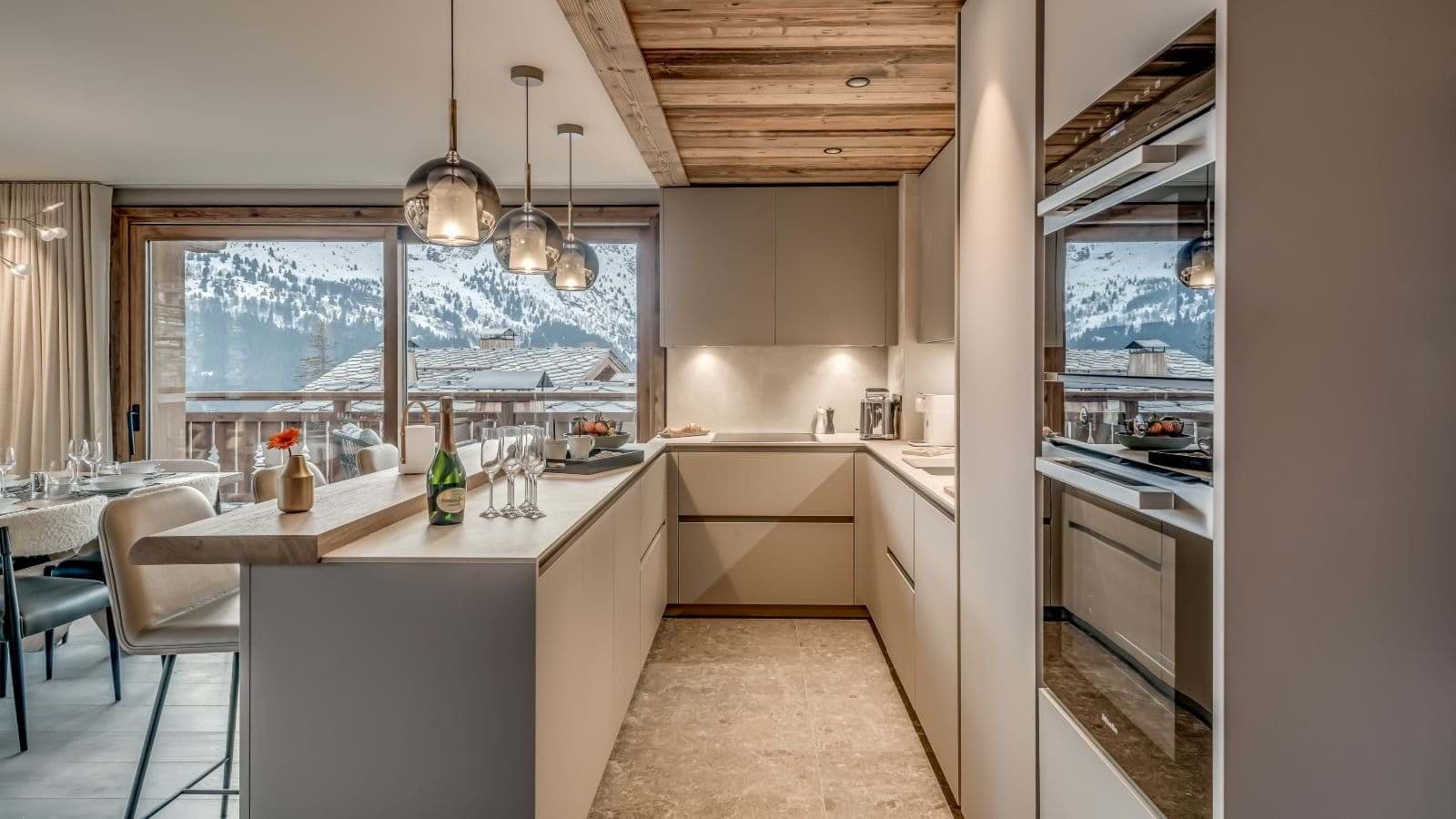 Kitchen with double wall ovens and mountain views from the breakfast bar