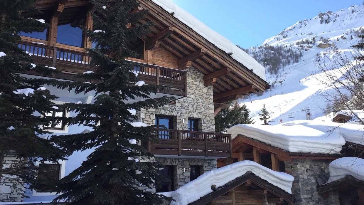 Ski-in, ski-out chalet with stone facade and private balconies