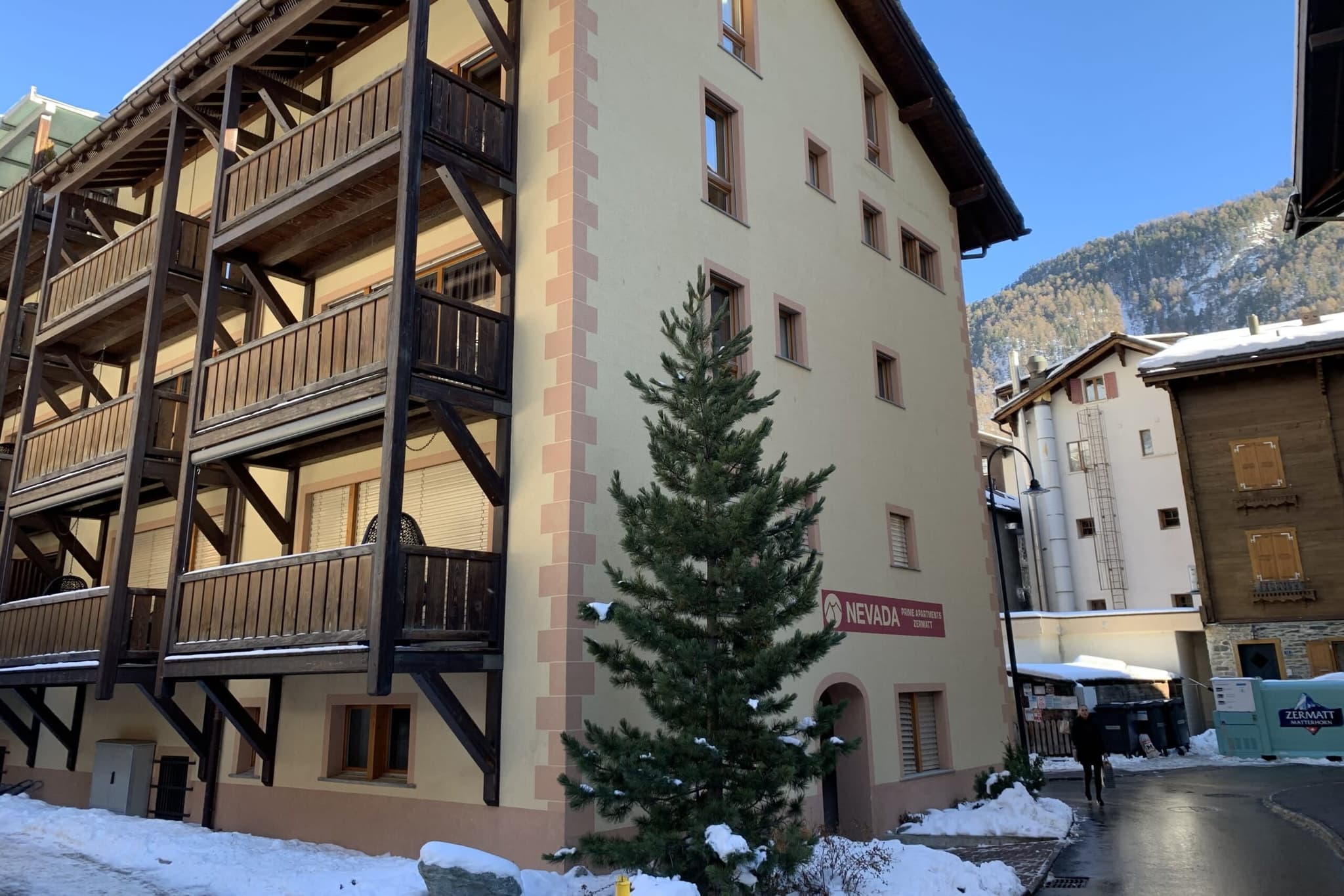Building exterior with private balconies and mountain views