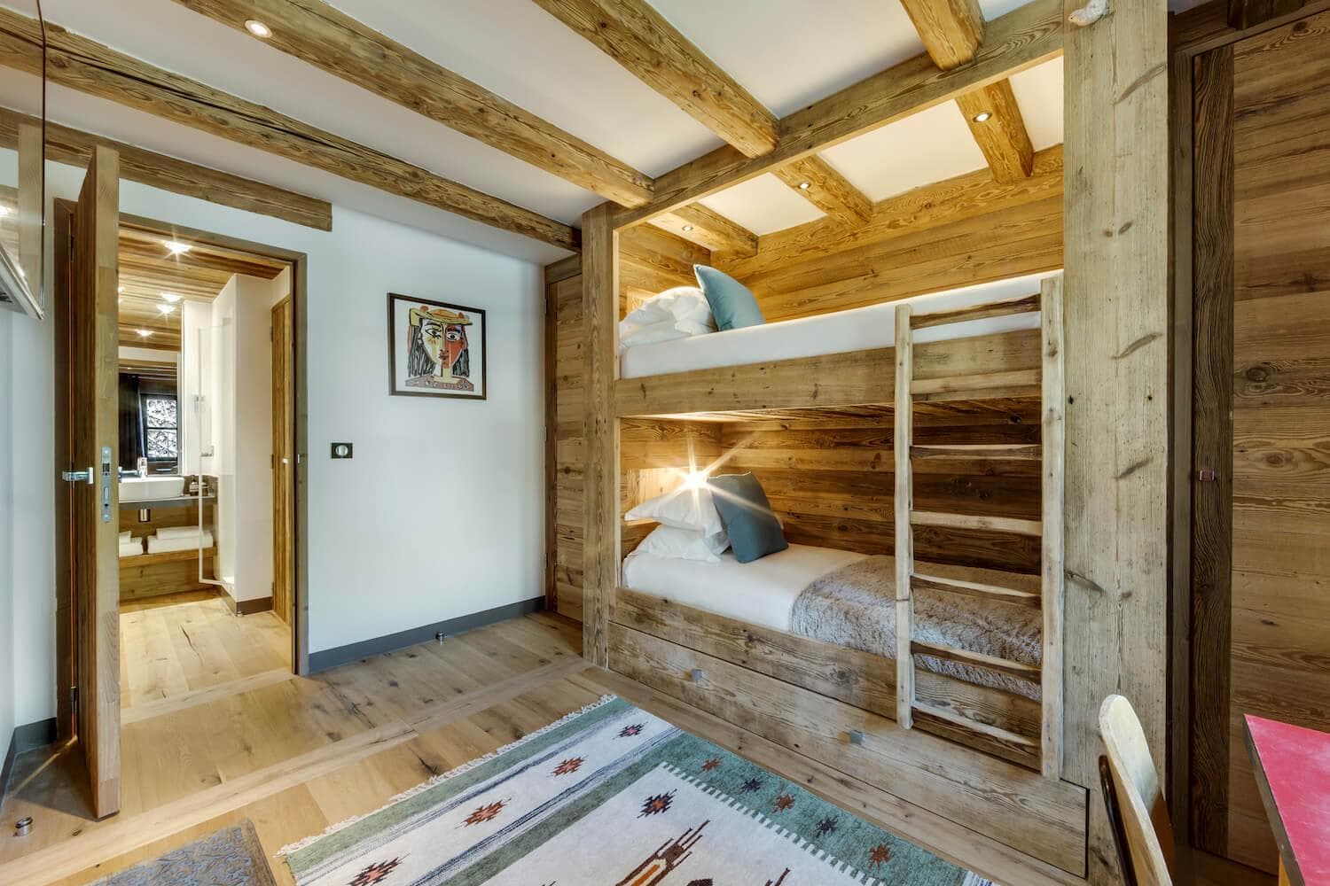 Bunk room with built-in twin beds and ensuite bathroom access