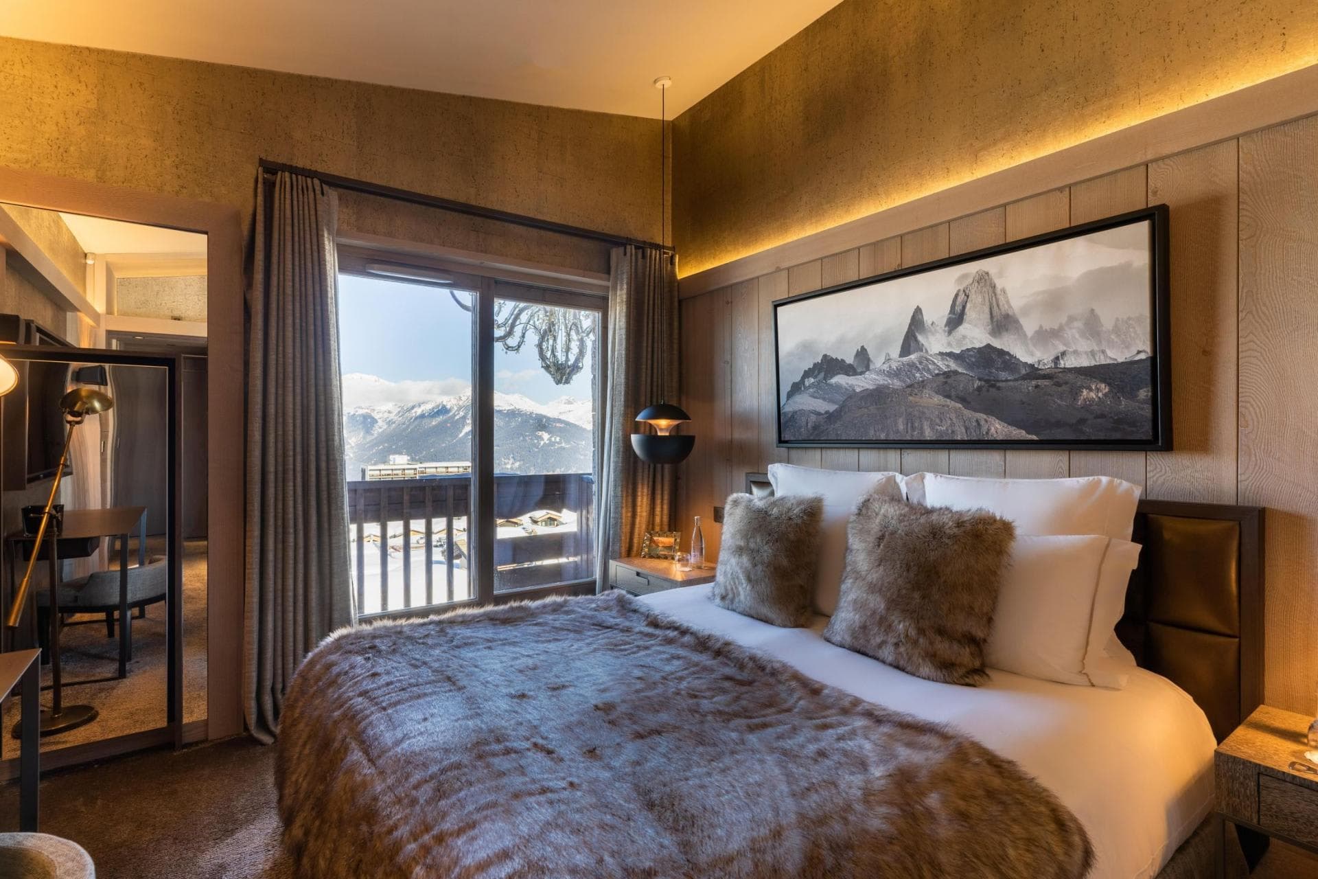 Primary bedroom with balcony access and mountain views